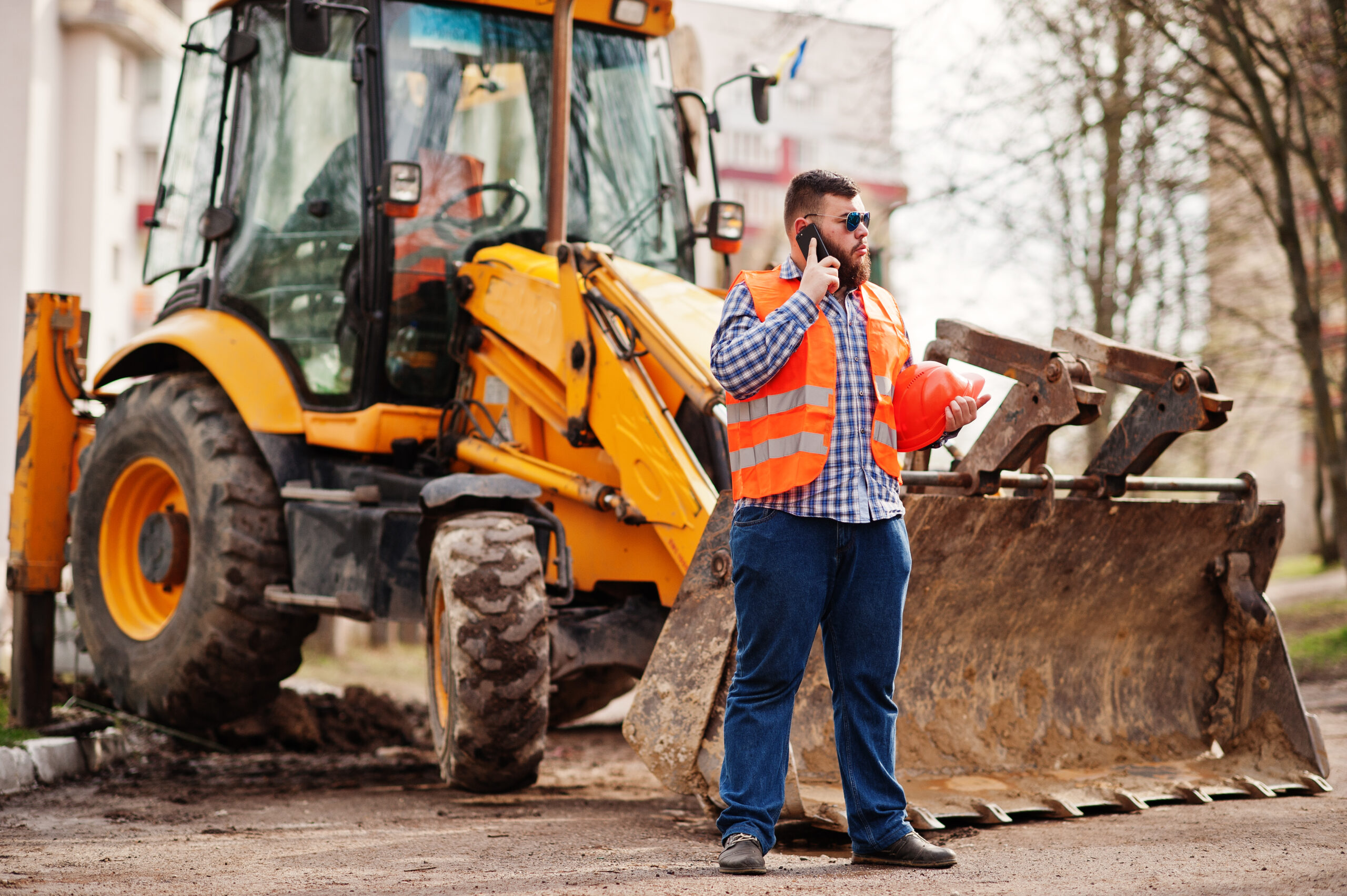 Beard worker man suit construction worker in safety orange helme